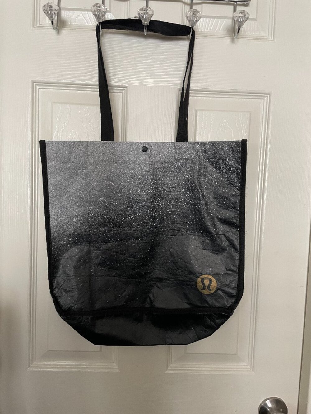 Lululemon reusable tote bag featuring a black-and-silver glitter ombre finish